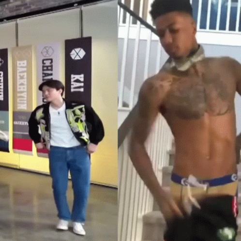 A Man Without A Shirt Is Standing Next To A Man With A Tattoo On His Chest GIF