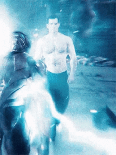 A Man Without A Shirt Is Walking Through A Foggy Room GIF