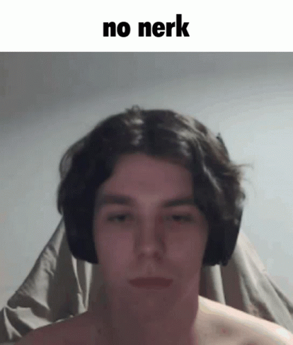 A Man Without A Shirt Is Wearing Headphones And Making A Face . GIF