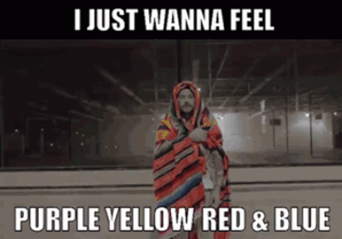 A Man Wrapped In A Blanket With The Words I Just Wanna Feel Purple Yellow Red And Blue GIF