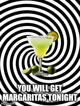 A Margarita In A Glass With Limes On A Black And White Swirl Background . GIF