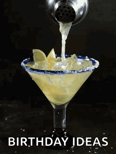A Margarita Is Being Poured Into A Martini Glass With The Words Birthday Ideas On The Bottom GIF