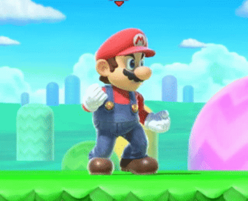 A Mario Video Game Character Is Standing On A Green Hill GIF
