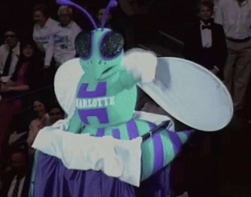 A Mascot For Charlotte Is Wearing A Blue And Purple Outfit GIF