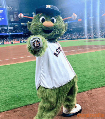 A Mascot For The Astros Is Holding A Ball GIF