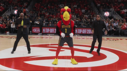 A Mascot For The Atlanta Hawks Dancing On The Court GIF