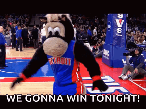 A Mascot For The Detroit Pistons Is Dancing On The Court GIF
