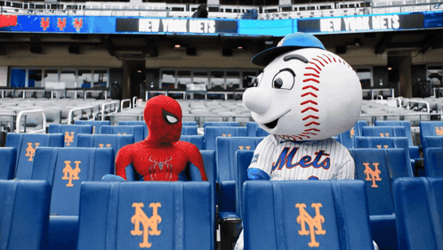 A Mascot For The New York Mets Sitting Next To A Mascot For Spider-Man GIF