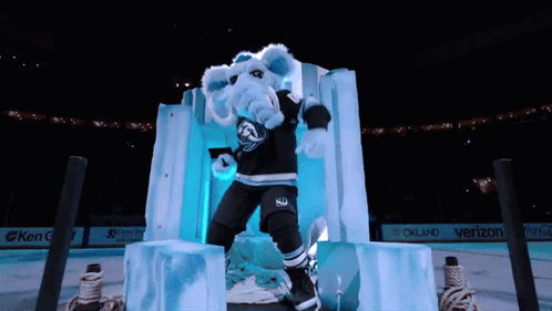 A Mascot For The Oakland Sharks Is Standing On Ice GIF