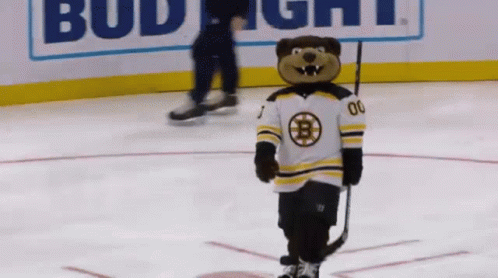 A Mascot Holding A Hockey Stick And Wearing A Jersey With The Letter B On It GIF