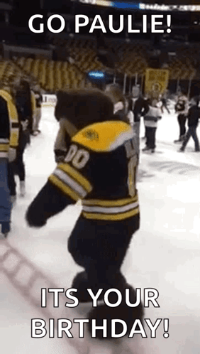 A Mascot Is Dancing On The Ice And Says `` Go Paulie ! Its Your Birthday ! '' GIF