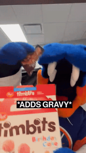 A Mascot Is Holding A Box Of Timbits Birthday Cake GIF