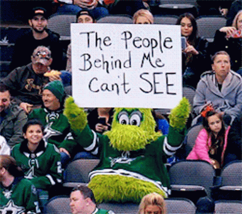 A Mascot Is Holding A Sign That Says The People Behind Me Can 'T See GIF