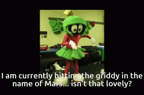 A Mascot Named Marvin The Martian Is Dancing In A Room GIF