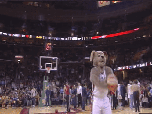 A Mascot On A Basketball Court Wearing A Jersey With The Letter C On The Back GIF