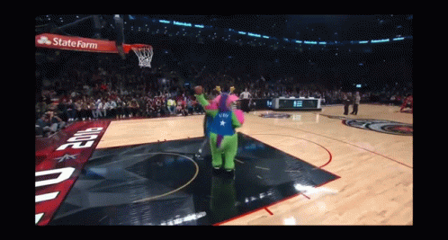 A Mascot On A Basketball Court With A State Farm Ad GIF