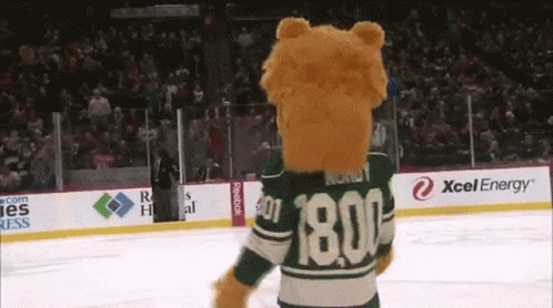 A Mascot Wearing A Green Jersey With The Number 1800 GIF