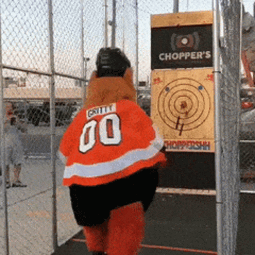 A Mascot Wearing A Jersey With The Number 00 On It GIF