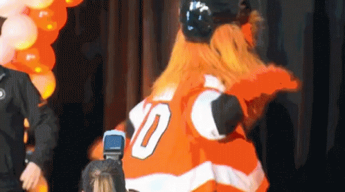 A Mascot Wearing A Jersey With The Number 10 GIF