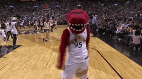 A Mascot Wearing A Number 95 Jersey Stands On A Basketball Court GIF