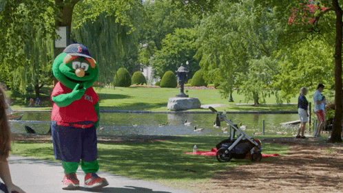 A Mascot Wearing A Red White And Blue Shirt That Says Boston Red Sox GIF