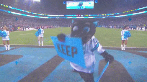 A Mascot With A Sign That Says Keep On It GIF