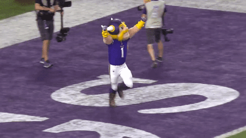 A Mascot With The Number 1 On His Shirt GIF