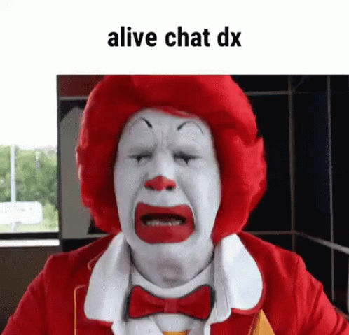 A Mcdonald 'S Clown Is Crying With His Eyes Closed And A Red Wig . GIF