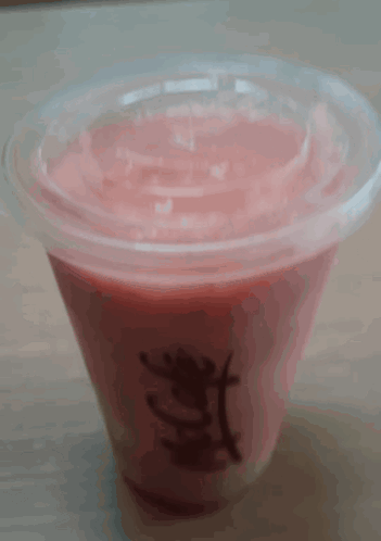 A Mcdonald 'S Cup Filled With Pink Liquid GIF