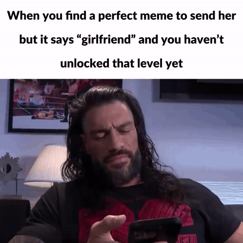 A Meme Of A Man Looking At His Phone With The Caption When You Find A Perfect Meme To Send Her GIF