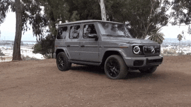 A Mercedes Is Parked On A Dirt Road GIF