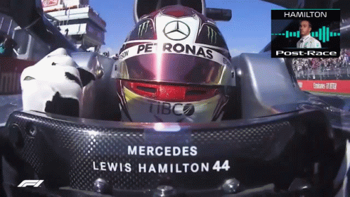 A Mercedes Lewis Hamilton 44 Helmet Sits In A Race Car GIF