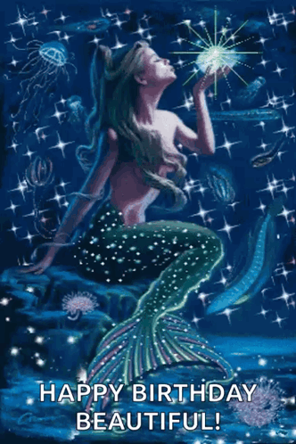 A Mermaid Is Sitting On A Rock In The Ocean And Holding A Star . GIF