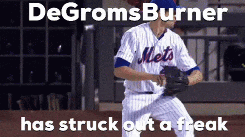 A Mets Baseball Player Is Getting Ready To Pitch The Ball GIF