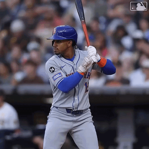 A Mets Baseball Player Is Getting Ready To Swing His Bat GIF