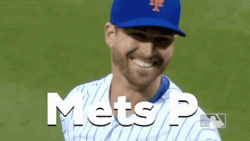 A Mets Baseball Player Is Smiling And Wearing A Blue Cap GIF