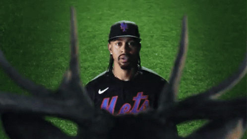 A Mets Baseball Player Stands In Front Of A Deer GIF