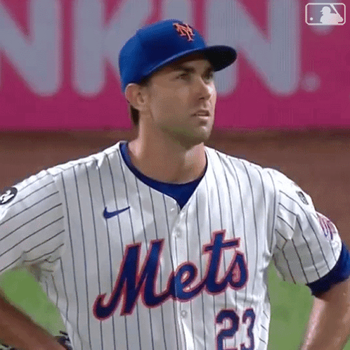 A Mets Baseball Player Wearing A Blue Hat And Jersey GIF
