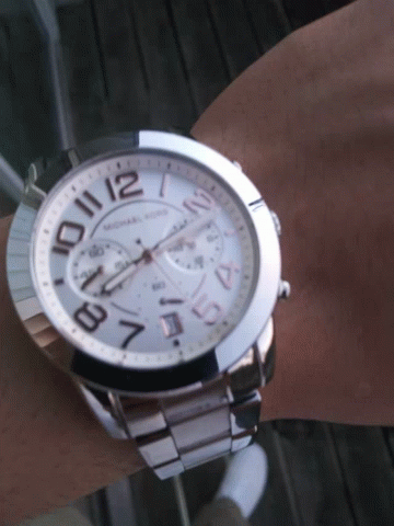 A Michael Kors Watch On A Person 'S Wrist GIF