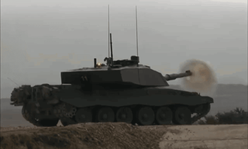 A Military Tank With The Number 14 On It GIF