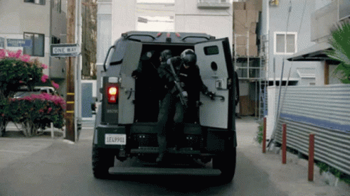 A Military Vehicle Has A License Plate That Says Eaa9910 GIF
