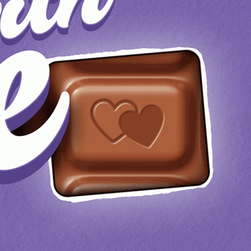 A Milka Chocolate Bar With Two Hearts Carved Into It GIF