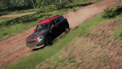 A Mini Cooper Is Driving Down A Dirt Road In A Video Game GIF