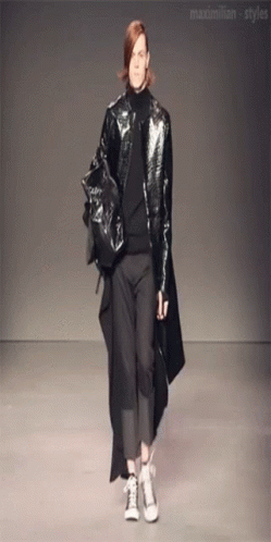 A Model Walks Down The Runway At A Fashion Show Sponsored By Maximilian-Styles GIF