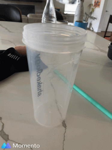 A Momento Photo Of A Cup With A Wooden Stick In It GIF