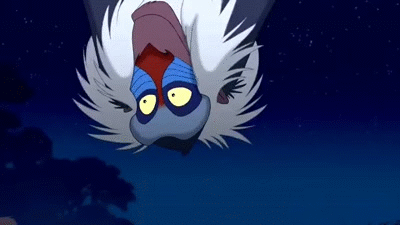 A Monkey From The Lion King Is Flying Upside Down In The Air . GIF