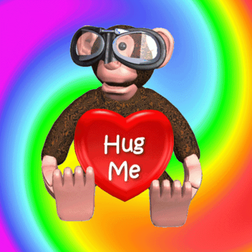 A Monkey Holding A Red Heart That Says Hug Me GIF