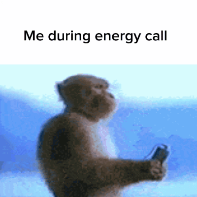 A Monkey Is Holding A Cell Phone With The Words Me During Energy Call Below It . GIF