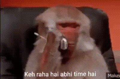 A Monkey Is Sitting In A Chair With A Gun In Its Mouth And Says Keh Raha Hai Abhi Time Hai . GIF