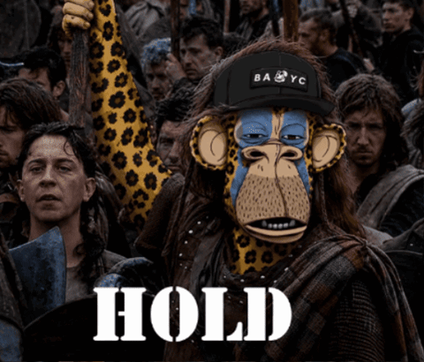 a monkey wearing a ba yc hat stands in a crowd of people